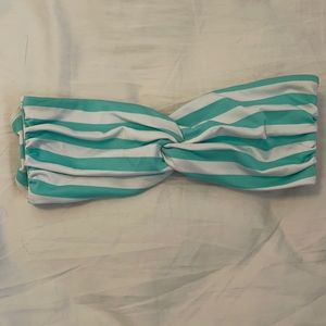 Light green and white striped bikini top.